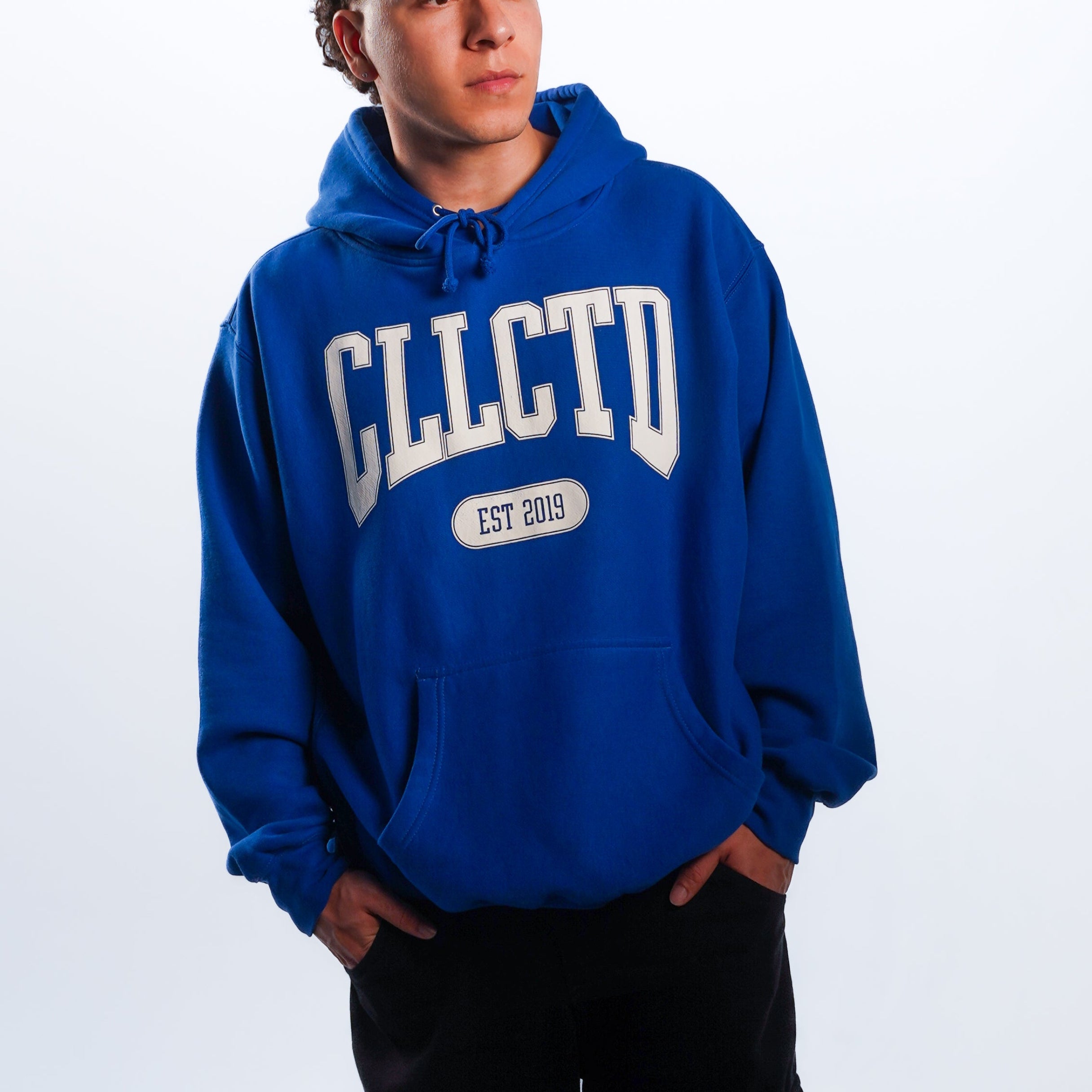 Person wearing a blue hoodie with 'CLLCTD' text on a white background
