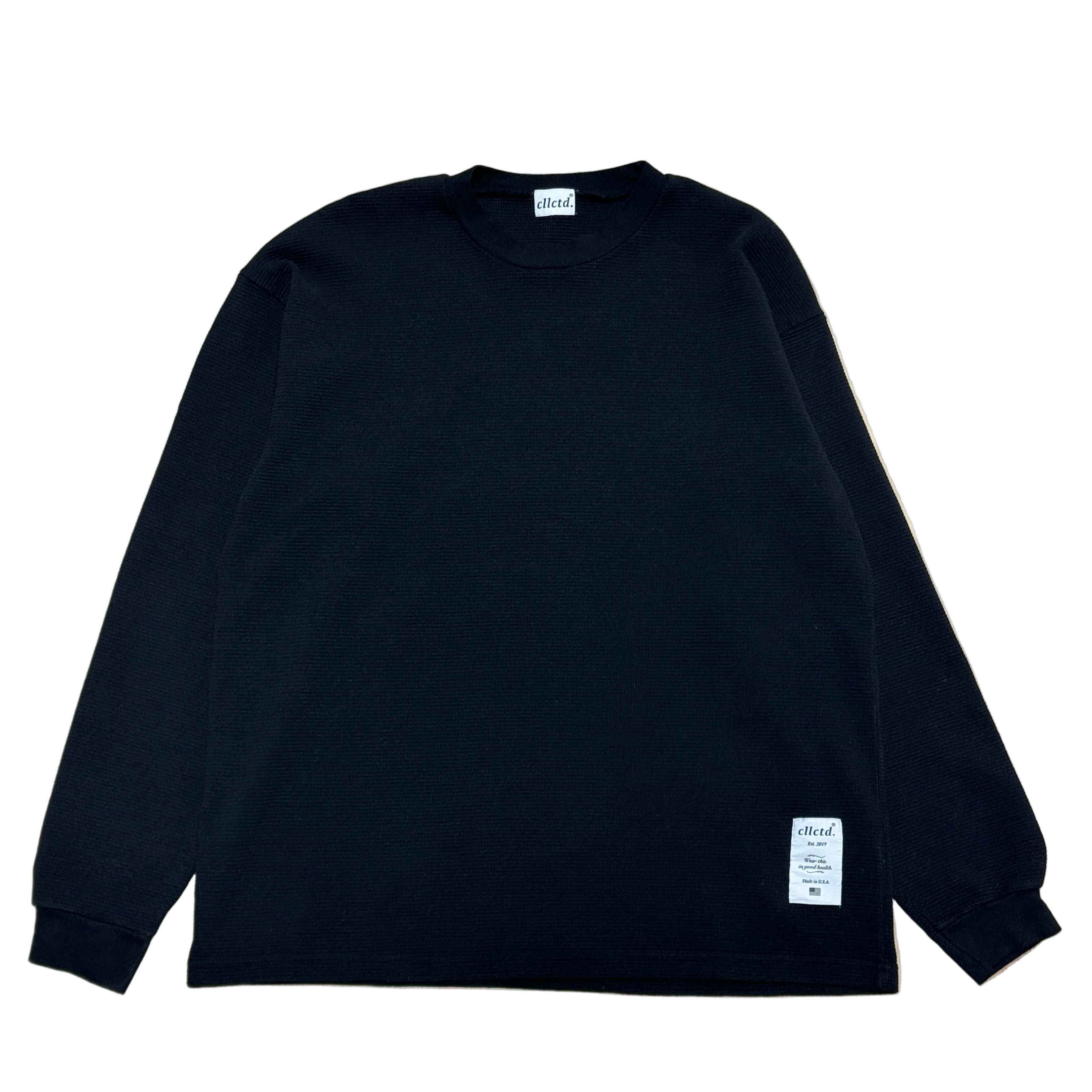 Black long-sleeve shirt with a brand label on a white background