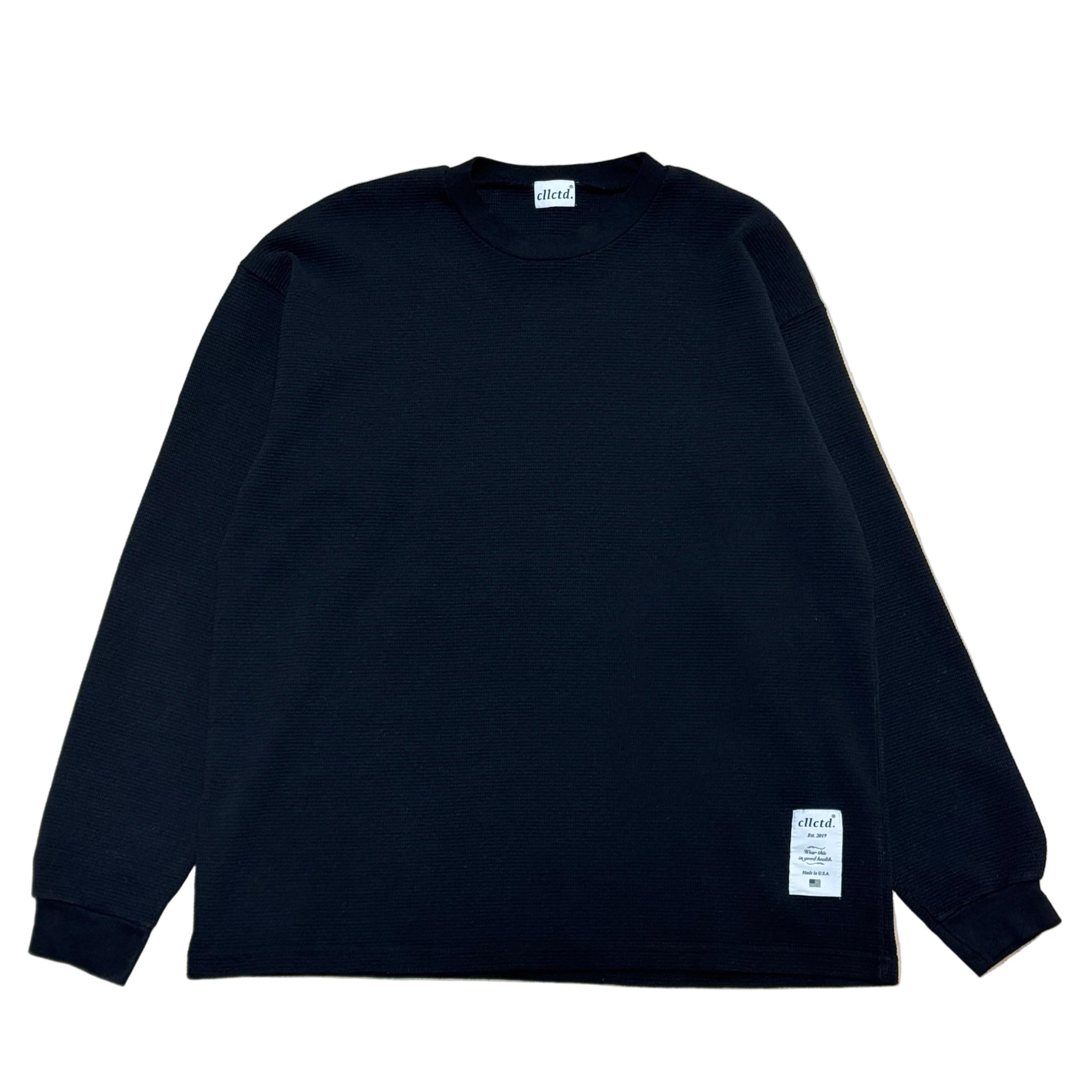 Black long-sleeve shirt with a brand label on a white background